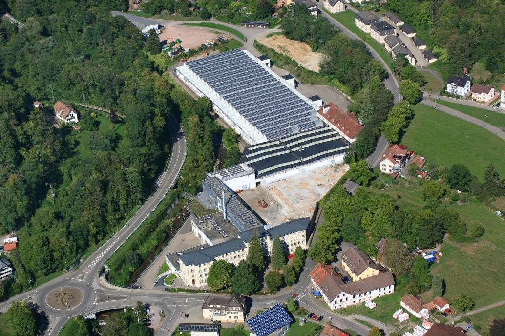 Wehr from above - Panel rows of photovoltaic and solar farm or solar power plant on the company's roof and roof areas of the former textile company Brennet AG in Wehr (Baden) in the state Baden-Wurttemberg