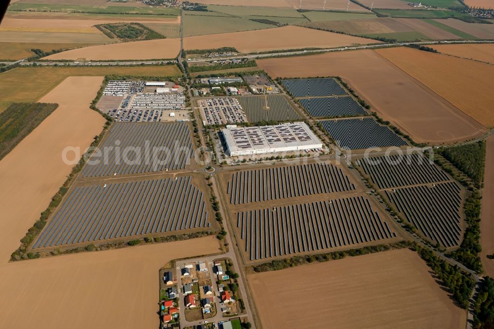 Landsberg from the bird's eye view: Panel rows of photovoltaic and solar farm or solar power plant in the commercial area in the district Sietzsch in Landsberg in the state Saxony-Anhalt, Germany