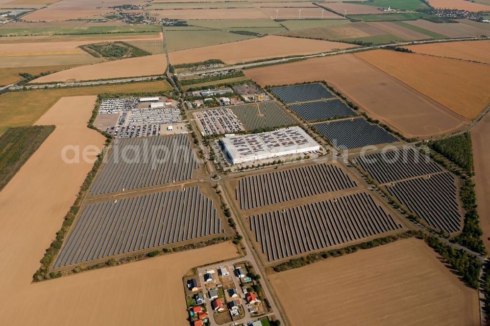 Aerial image Landsberg - Panel rows of photovoltaic and solar farm or solar power plant in the commercial area in the district Sietzsch in Landsberg in the state Saxony-Anhalt, Germany