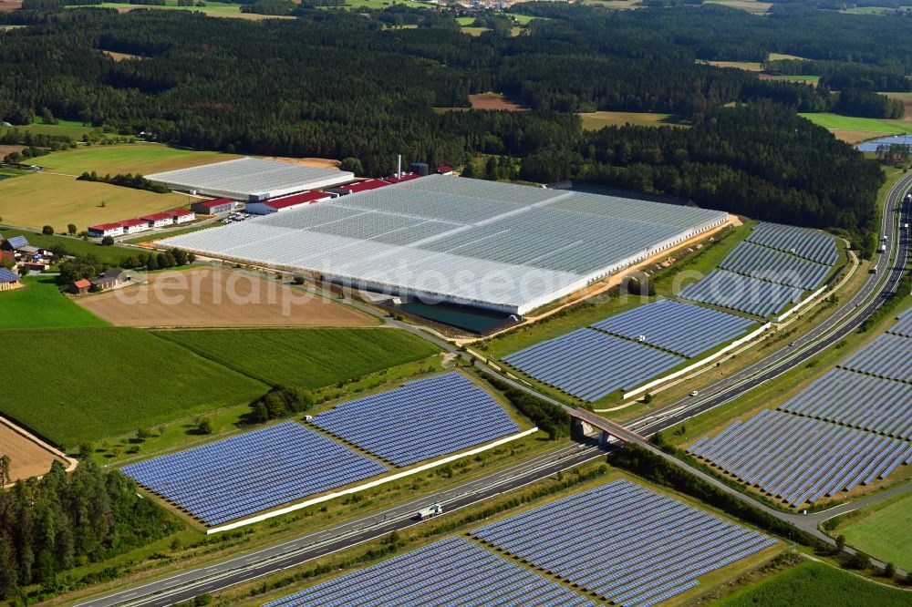Aerial photograph Wonsees - Panel rows of photovoltaic and solar farm or solar power plant Jura-Solarpark on BAB A70 in Wonsees in the state Bavaria, Germany
