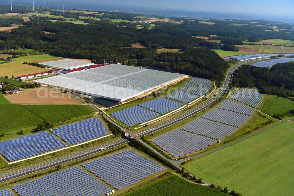 Wonsees from above - Panel rows of photovoltaic and solar farm or solar power plant Jura-Solarpark on BAB A70 in Wonsees in the state Bavaria, Germany