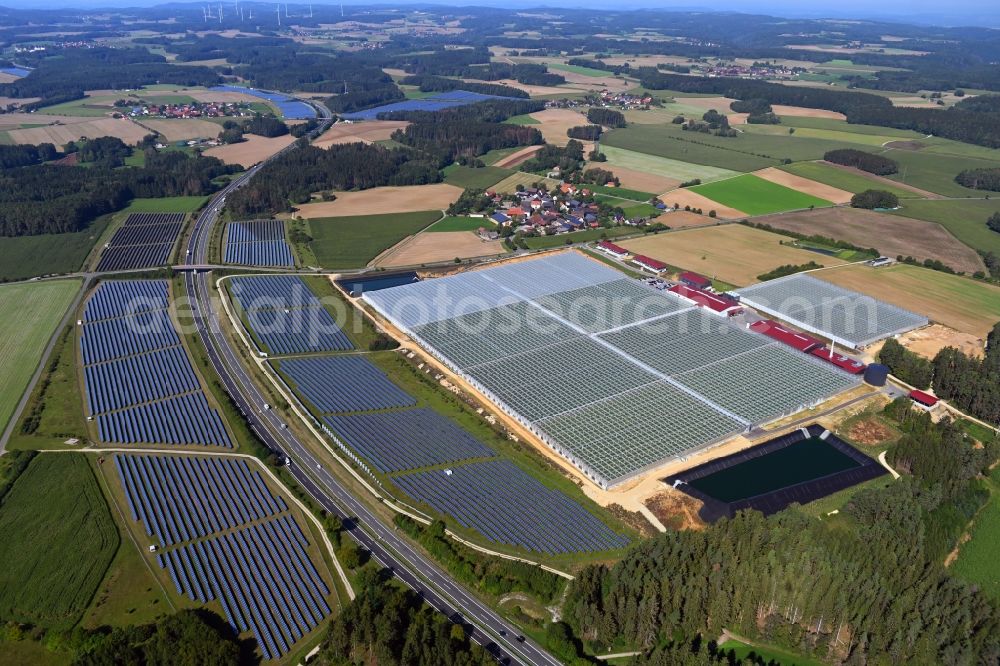 Aerial photograph Wonsees - Panel rows of photovoltaic and solar farm or solar power plant Jura-Solarpark on BAB A70 in Wonsees in the state Bavaria, Germany