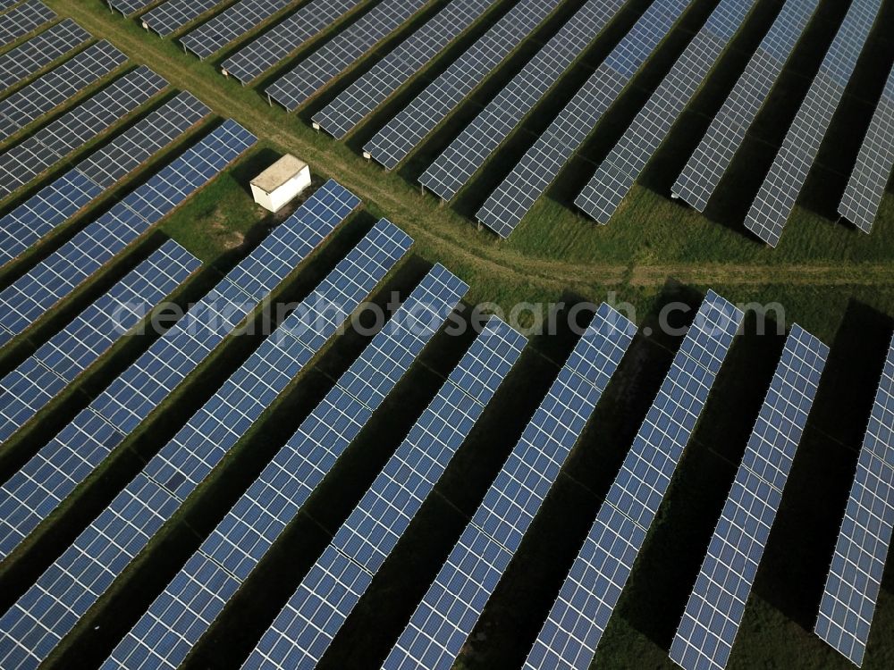 Aerial photograph Kanena - Bruckdorf - Panel rows of photovoltaic and solar farm or solar power plant in Kanena - Bruckdorf in the state Saxony-Anhalt, Germany