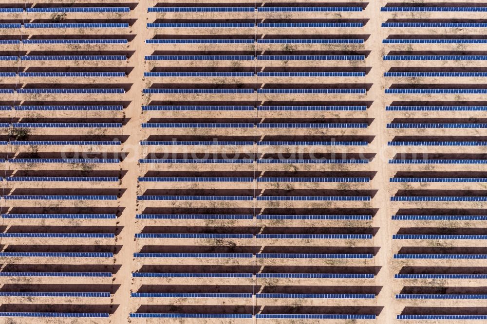 Aerial image Kingman - Panel rows of photovoltaic and solar farm or solar power plant in Kingman in Arizona, United States of America