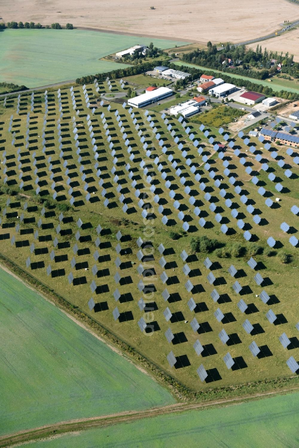 Grimma from above - Panel rows of photovoltaic and solar farm or solar power plant der Kirchner Solar Group GmbH in Grimma in the state Saxony