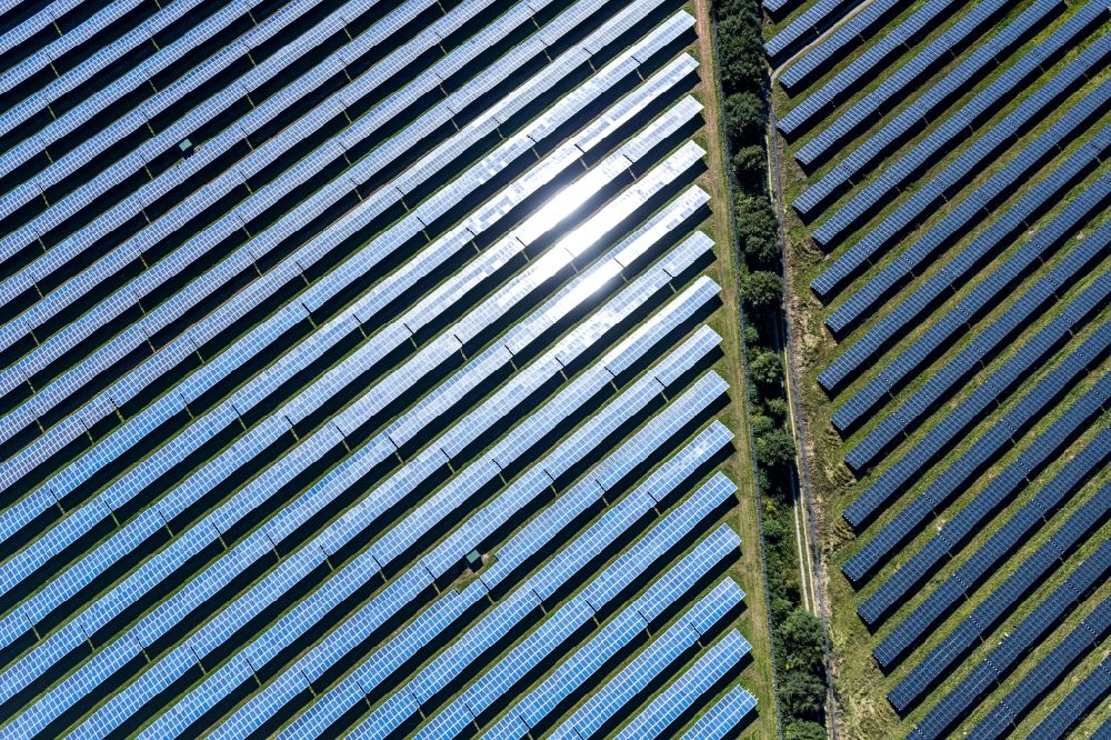 Aerial image Bad Driburg - Panel rows of photovoltaic and solar farm or solar power plant on Satzer Moor on Industriestrasse in the district Herste in Bad Driburg in the state North Rhine-Westphalia, Germany