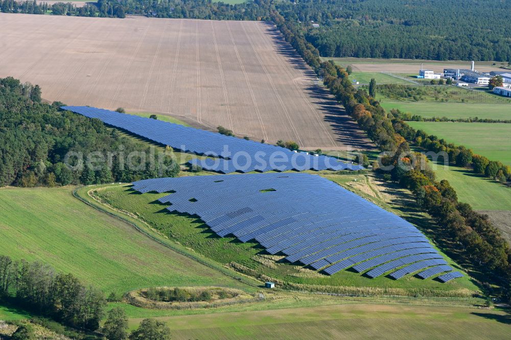 Aerial photograph Werneuchen - Panel rows of photovoltaic and solar farm or solar power plant in Werneuchen in the state Brandenburg, Germany
