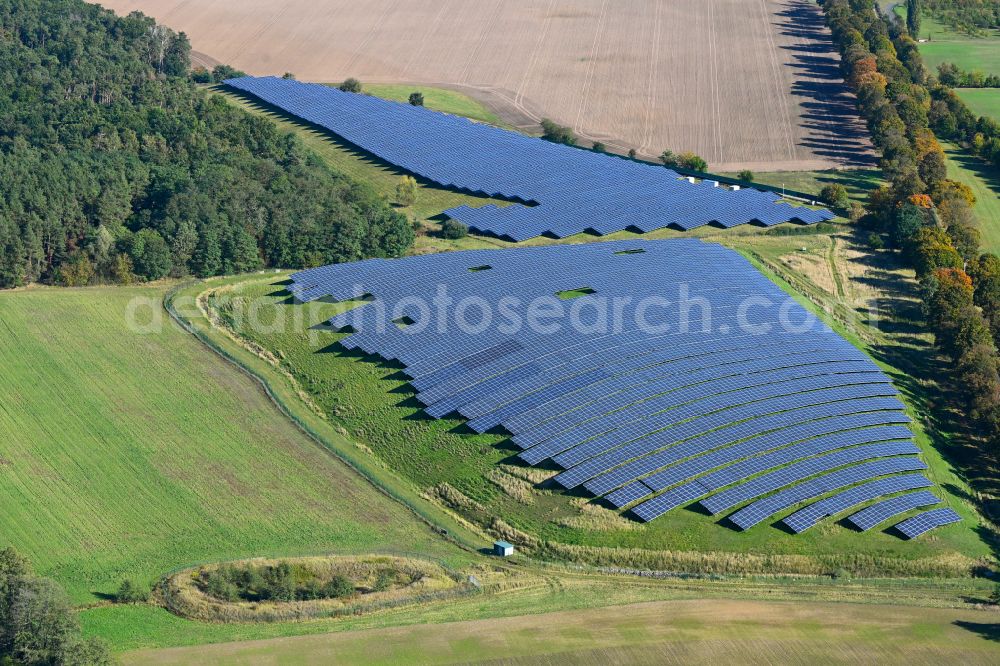 Werneuchen from above - Panel rows of photovoltaic and solar farm or solar power plant in Werneuchen in the state Brandenburg, Germany