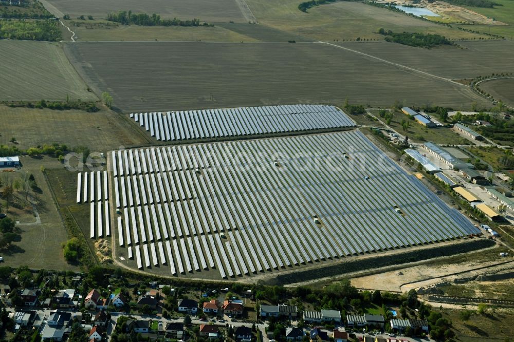 Aerial image Wolfen - Panel rows of photovoltaic and solar farm or solar power plant in Wolfen in the state Saxony-Anhalt, Germany