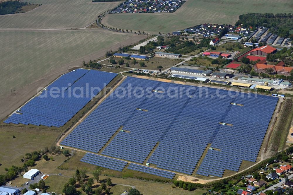 Wolfen from the bird's eye view: Panel rows of photovoltaic and solar farm or solar power plant in Wolfen in the state Saxony-Anhalt, Germany