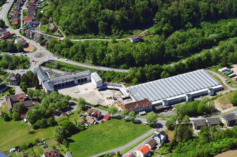 Aerial image Wehr - Panel rows of photovoltaic and solar farm on the company's roof of the former textile company Brennet AG in Wehr (Baden) in the state Baden-Wurttemberg. Part of the area is prepared for new residential buildings