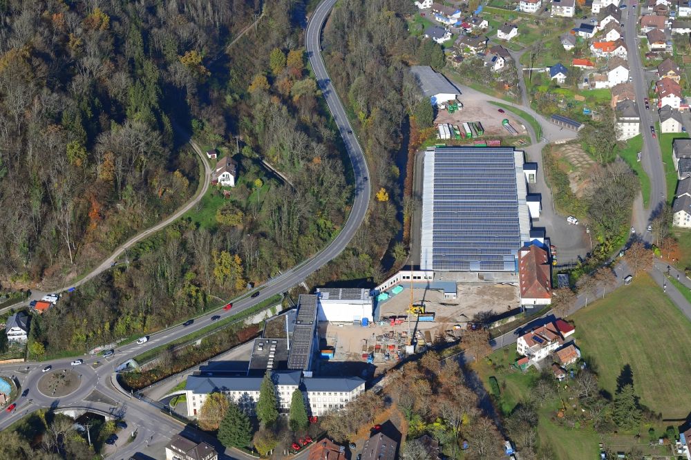 Wehr from above - Panel rows of photovoltaic and solar farm on the company's roof of the former textile company Brennet AG, Brennet GmbH and MBB Immobilien in Wehr (Baden) in the state Baden-Wurttemberg. Part of the area is prepared for new residential buildings