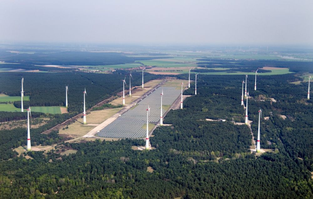 Mahlwinkel from above - Solar park and wind turbines in the Mahlwinkel part of the borough of Angern in the state of Saxony-Anhalt. A large number of solar cells and several wind turbines are located and constructed on site of the former military airbase