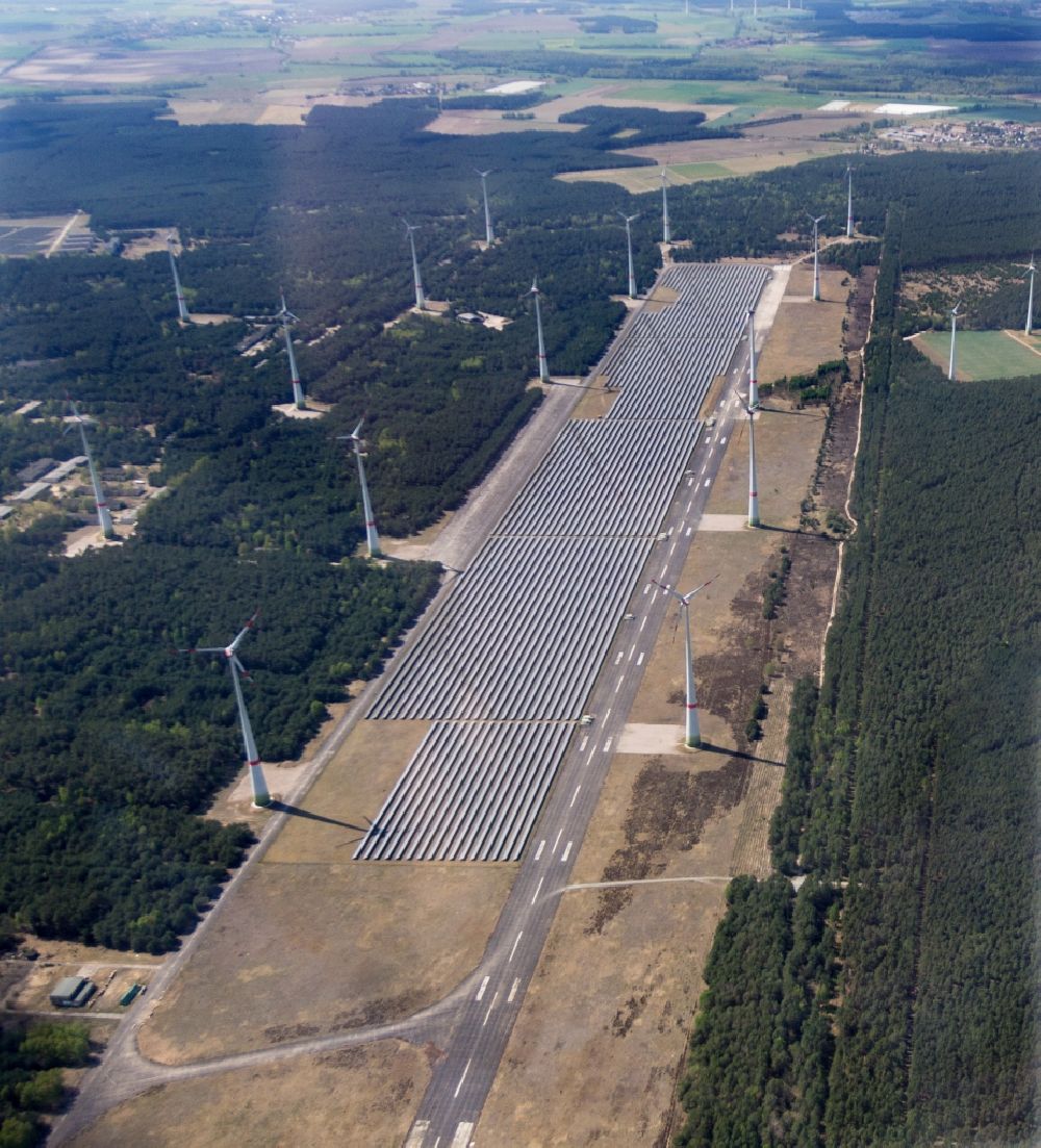 Mahlwinkel from above - Solar park and wind turbines in the Mahlwinkel part of the borough of Angern in the state of Saxony-Anhalt. A large number of solar cells and several wind turbines are located and constructed on site of the former military airbase