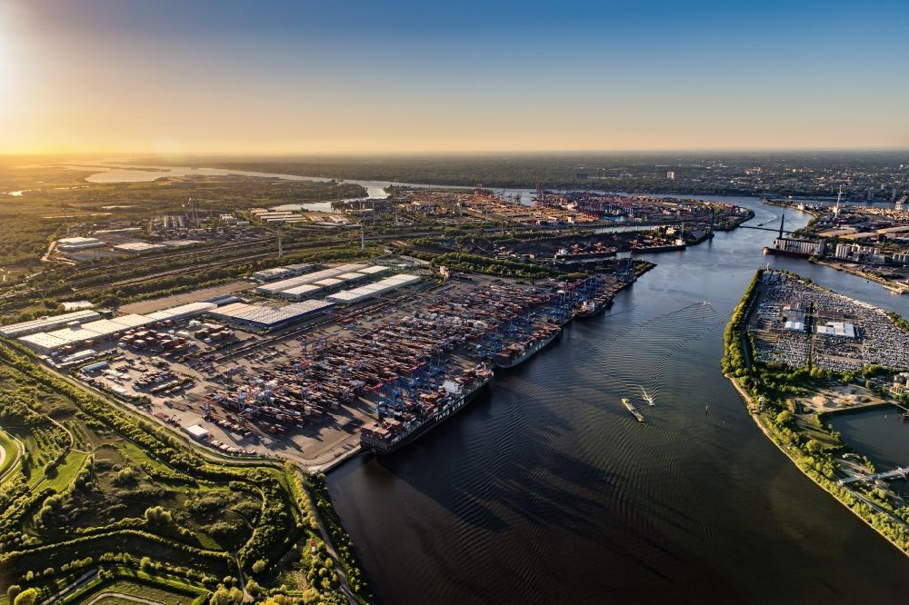 Aerial photograph Hamburg - Sunset over the landscape of harbor facilities along in Altenwerder district in Hamburg, Germany