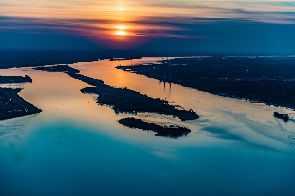 Hamburg from above - Sunrise over the landscape of the mist covered Elbe island along the Elbe river in the district Wedel in Hamburg, Germany