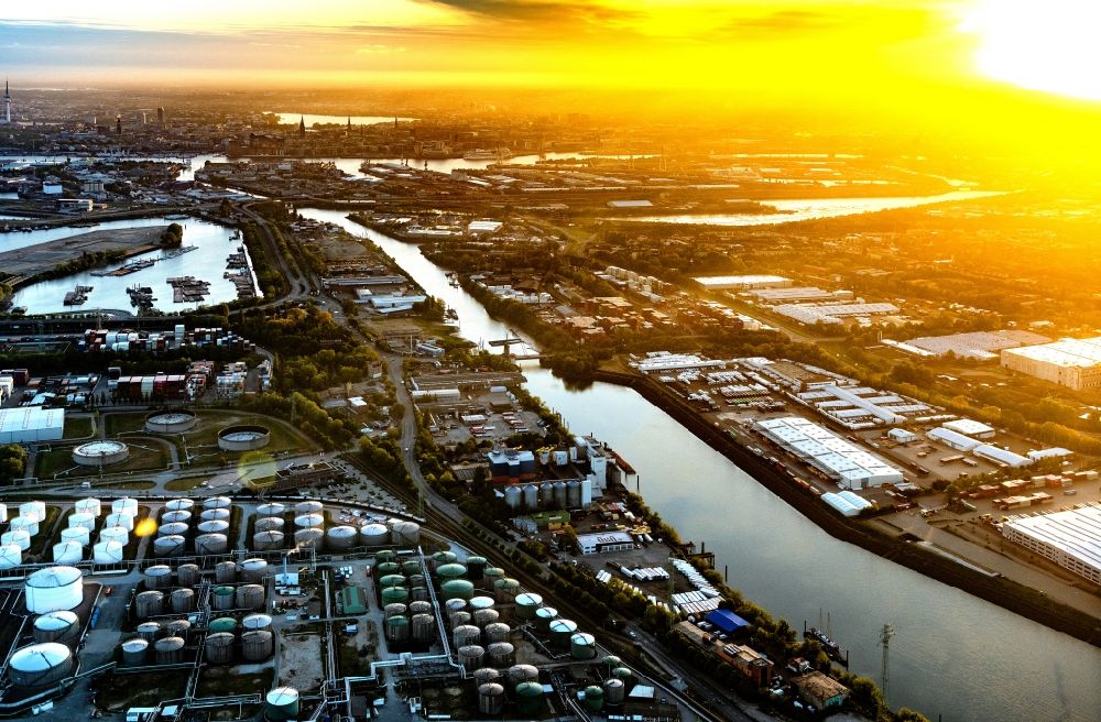 Hamburg from above - Sunrise over the mineral oil - tank at the canal on Oelhafen in Hamburg, Germany