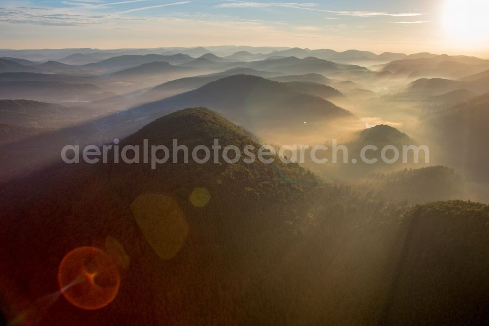 Erlenbach bei Dahn from the bird's eye view: Sunrise in the morning mist over the countryside valley of the Portzbach in southern forest of palatinat in Erlenbach bei Dahn in the state Rhineland-Palatinate