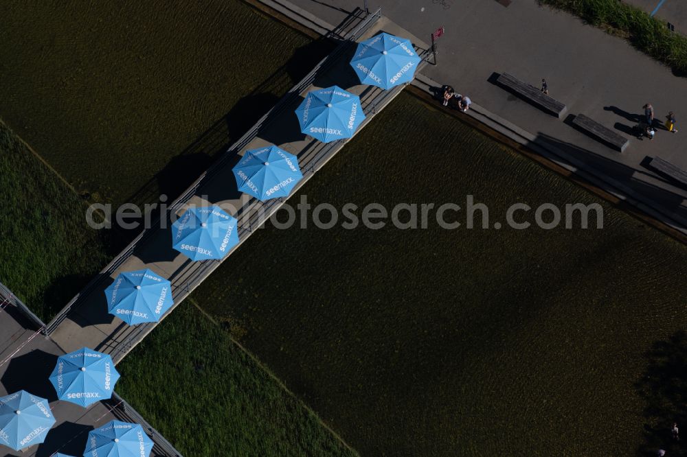 Radolfzell am Bodensee from the bird's eye view: Parasols of the seemaxx Outlet Center Radolfzell in Radolfzell am Bodensee on Lake Constance in the state Baden-Wuerttemberg, Germany