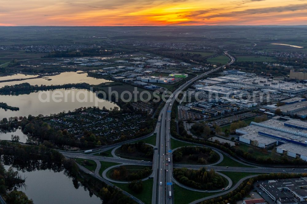 Aerial photograph Schweinfurt - Sunset traffic flow at the intersection- motorway A 7 Exit Centre in Schweinfurt in the state Bavaria, Germany