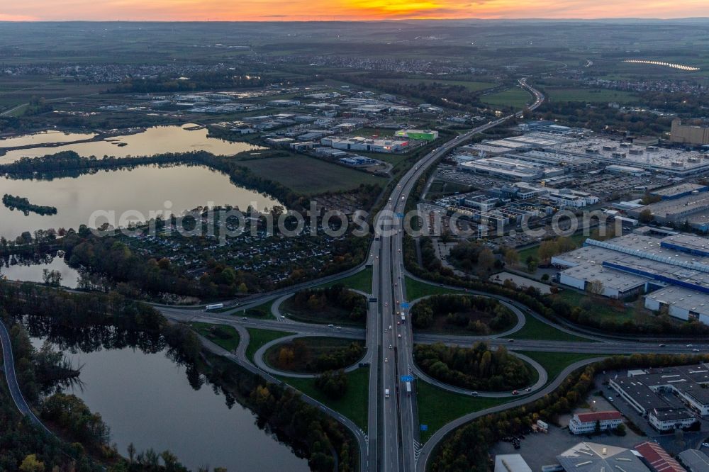 Aerial image Schweinfurt - Sunset traffic flow at the intersection- motorway A 7 Exit Centre in Schweinfurt in the state Bavaria, Germany