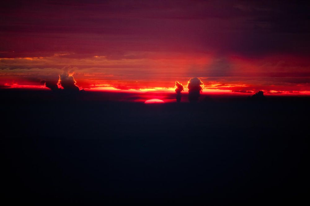Aerial image Lippetal - Nachtluftbild vom Sonnenuntergang am Horizont bei Lippetal in Nordrhein-Westfalen. Im Bild die Rauchwolken des Kraftwerk Westfalen und Hamm-Uetrop. Sunset at Lippetal in North Rhine-Westphalia.