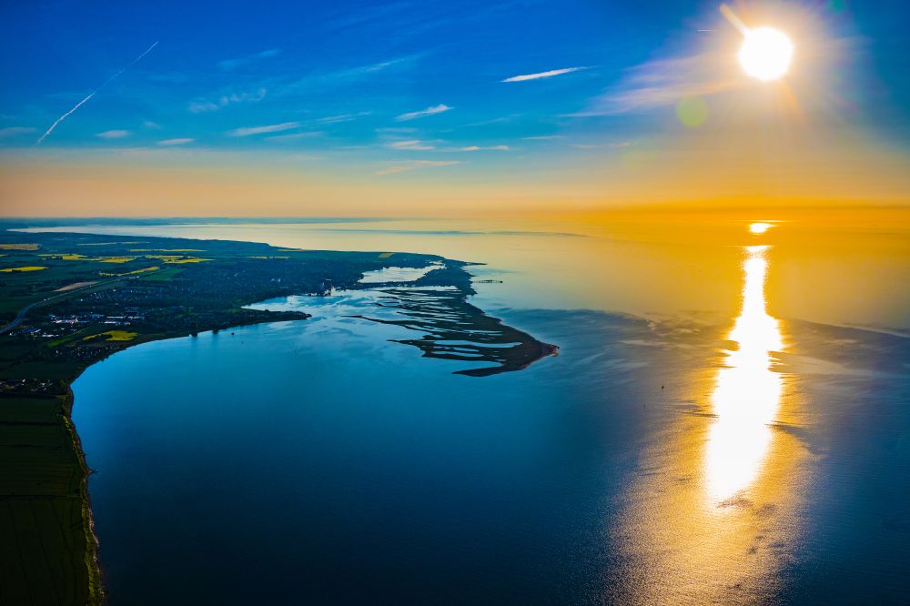 Großenbrode from the bird's eye view: Reflection and sun rays reflection on the water - surface in Grossenbrode on the Baltic Sea coast in the state Schleswig-Holstein, Germany
