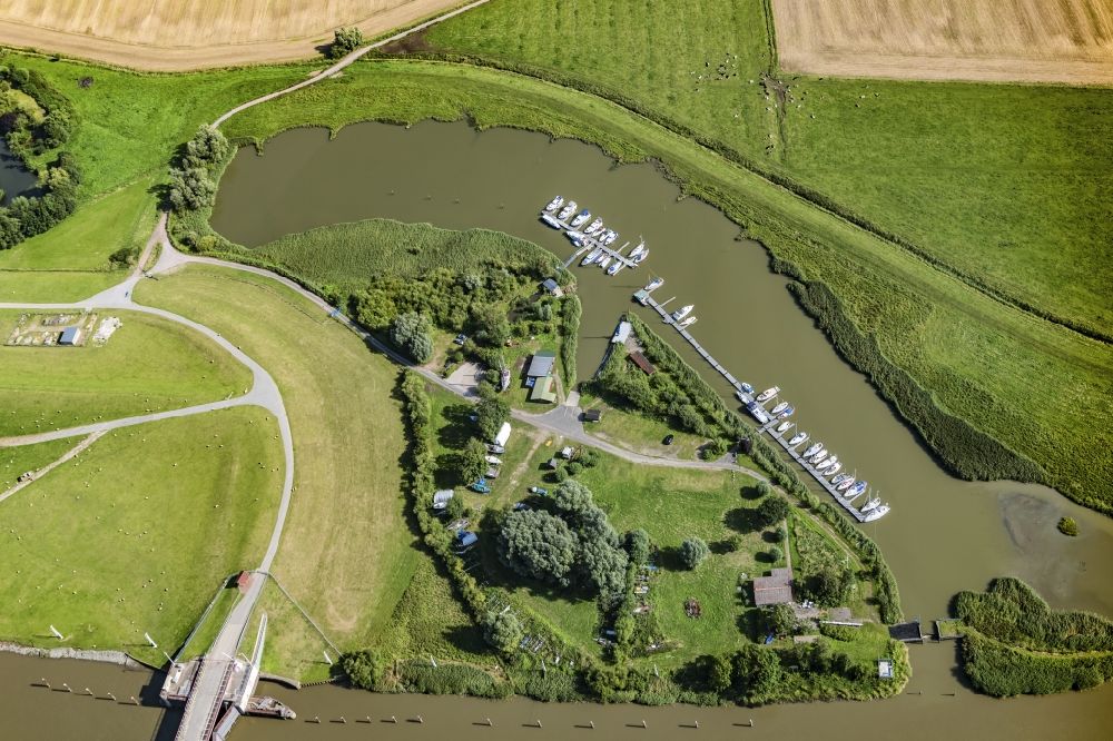 Haselau from above - Pleasure boat and sailing boat mooring and moorings in the harbor on the river bank area Segelvereinigung Pinnau in Haselau on the river Pinnau in the state Schleswig-Holstein, Germany