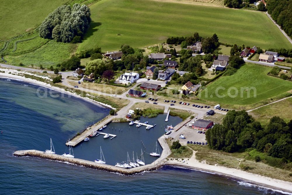 Stubbeköbing from above - Pleasure boat and sailing boat mooring and boat moorings in the harbor on the shore area Hesnaes in Stubbekoebing in Region Sjaelland, Denmark