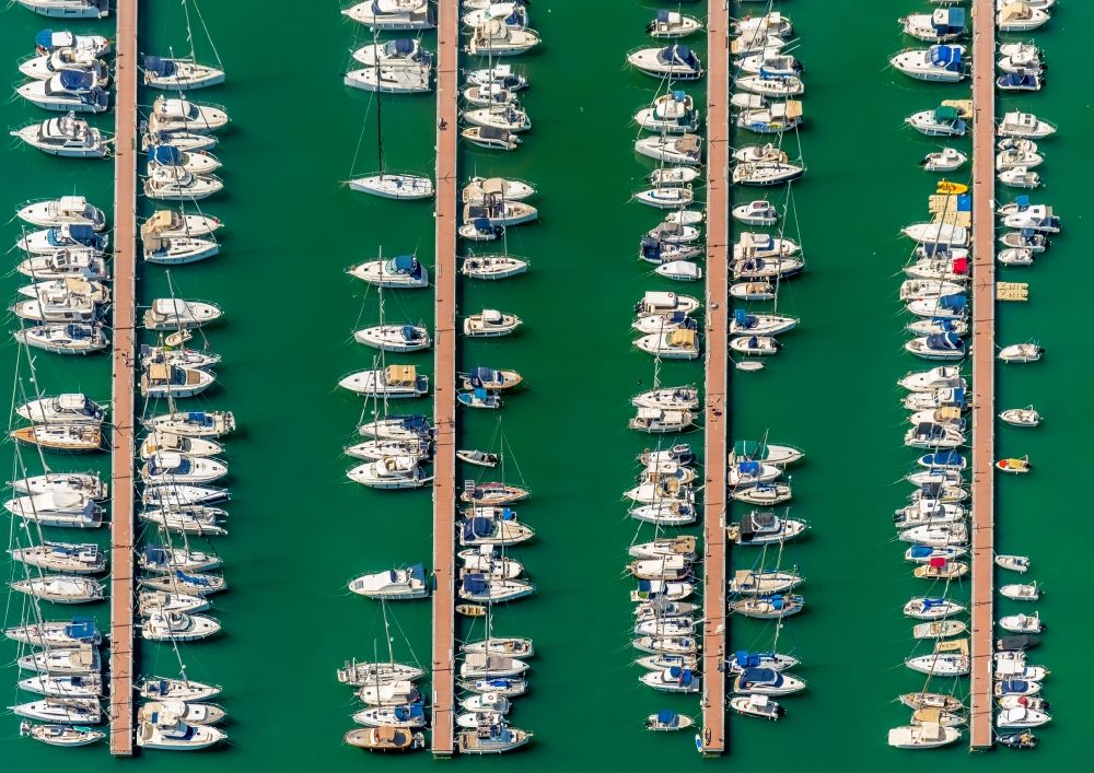 Alcudia from above - Pleasure boat and sailing boat mooring and boat moorings in the harbor in Port d'Alcudia in Balearic island of Mallorca, Spain