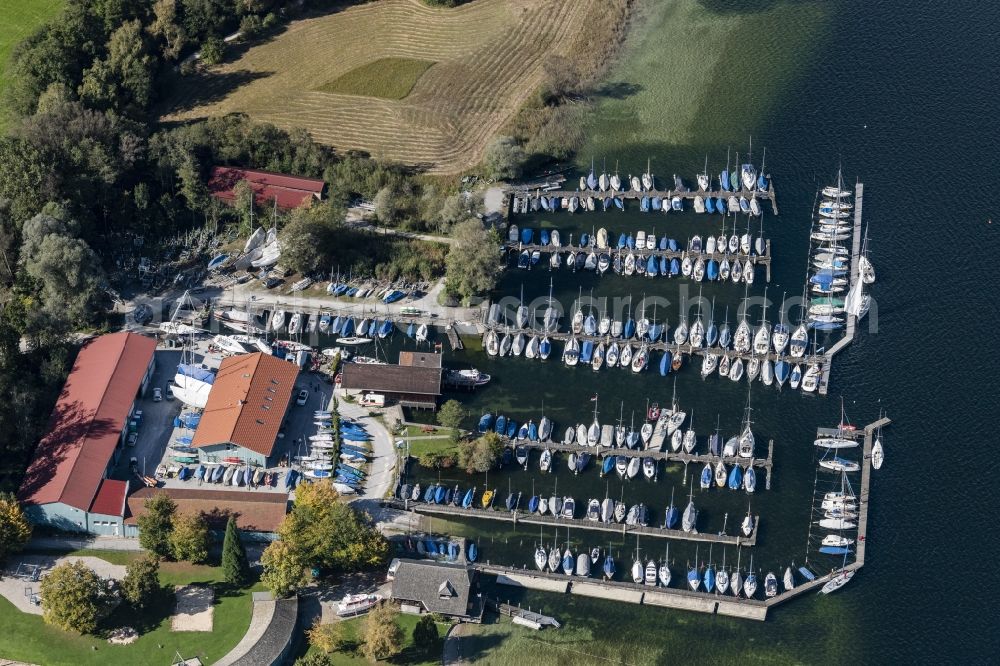 Prien am Chiemsee from the bird's eye view: Pleasure boat marina with docks and moorings on the shore area of Chiemsee in Sportboothafen Stippelwerft in Prien am Chiemsee in the state Bavaria, Germany