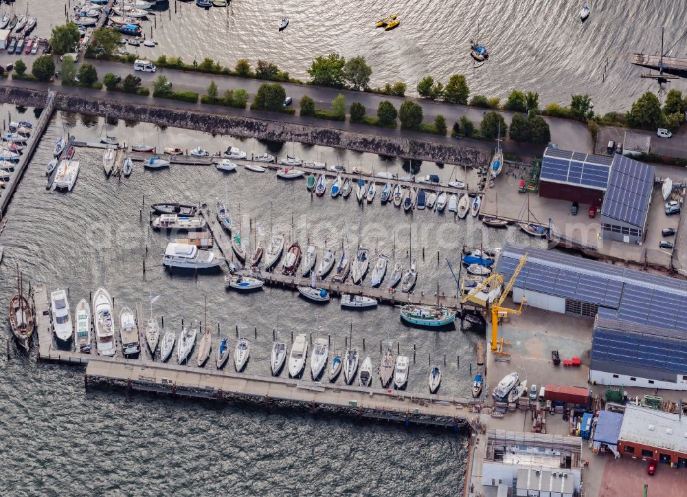 Kiel from above - Pleasure boat moorings and boat moorings on the shore area of the Kieler Foerde in the district Pries in Kiel in the state Schleswig-Holstein, Germany. Commercial space of the yacht and boat yard Marina Rathje GmbH