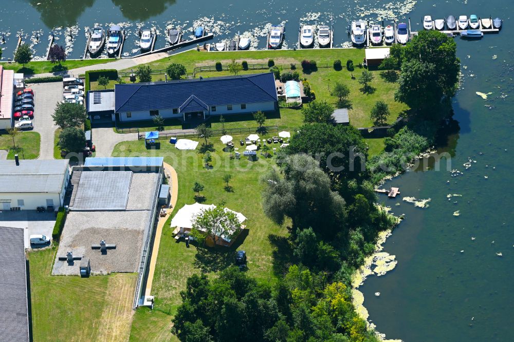 Rüdersdorf from above - Pleasure boat marina with docks and moorings on the shore area Strausberger Muehlenfliess - Hohler See in Ruedersdorf in the state Brandenburg, Germany
