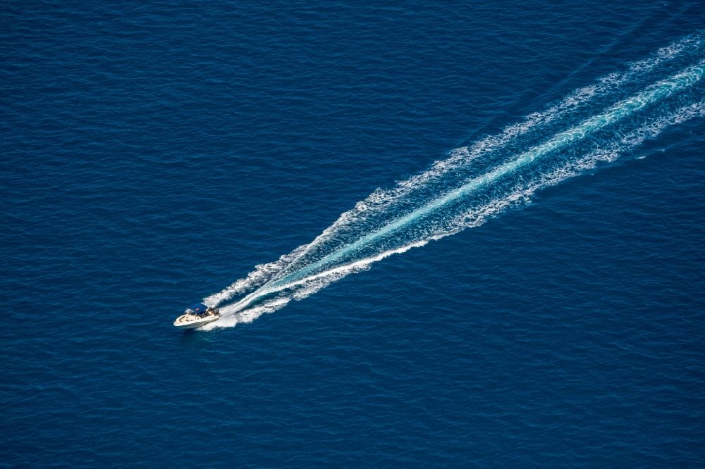 Port d'Alcudia from above - Sport boat - rowing boat ride in the bay of Alcudia in Port d'Alcudia in Balearic island of Mallorca, Spain