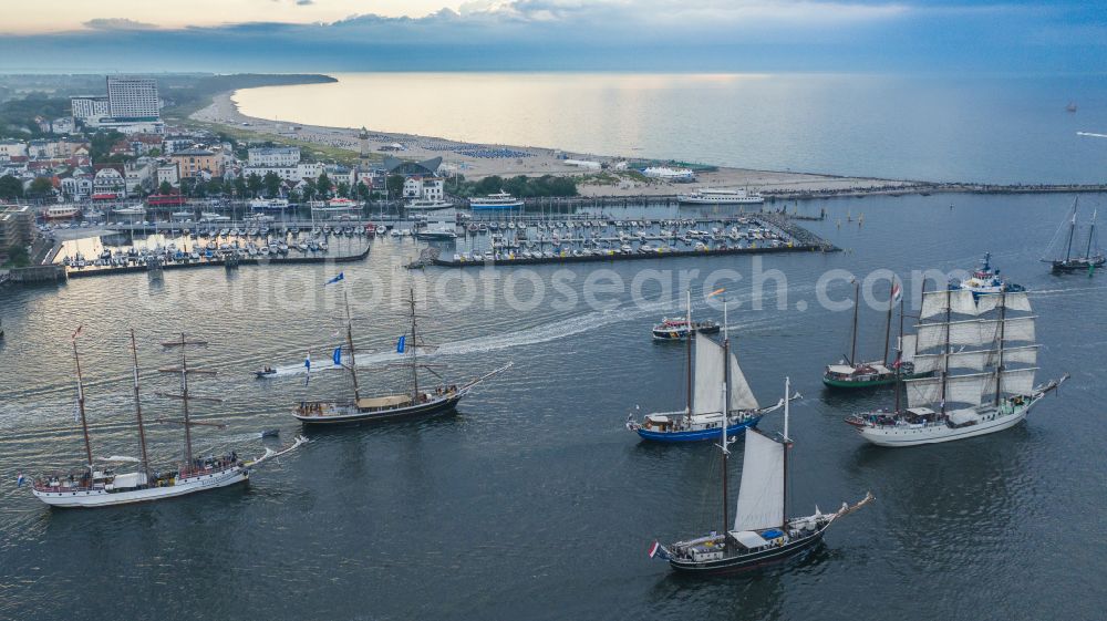 Aerial image Rostock - Pleasure boat sailing ships with white sails traveling to the Hansesail on the Warnow in the Warnemuende district in Rostock on the Baltic Sea coast in the state Mecklenburg-Western Pomerania, Germany