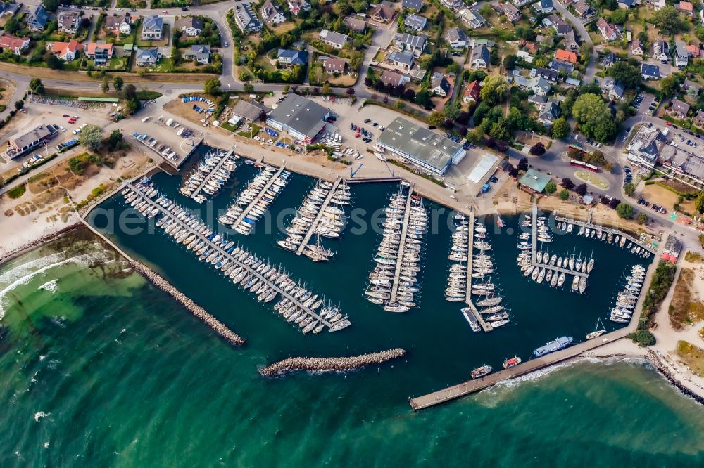 Strande from the bird's eye view: Sporthafen Strande on Strandstrasse in Strande in the state Schleswig-Holstein, Germany. Home port of the sailing clubs KYC Kieler Yacht Club and Yachtclub Strande YCS with boat halls and boat filling station