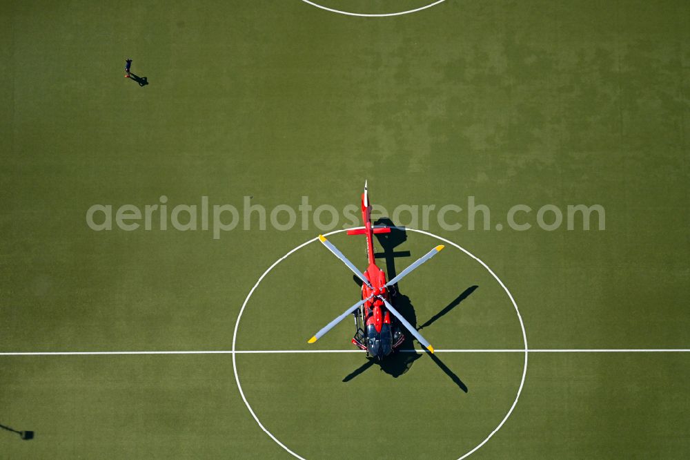 Aerial photograph Berlin - Sports grounds and football pitch with rescue helicopter employed for on emergency medical mission on street Gustav-Adolf-Strasse in Berlin, Germany