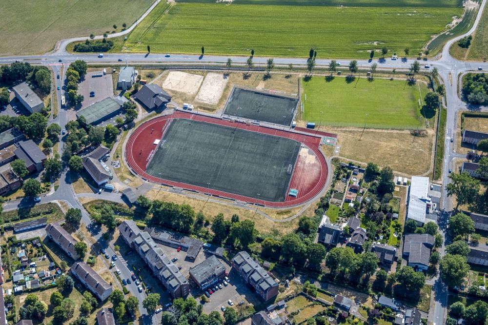 Moers from the bird's eye view: Sports grounds and football pitch on Stormstrasse ecke Lange Strasse in the district Repelen in Moers in the state North Rhine-Westphalia, Germany