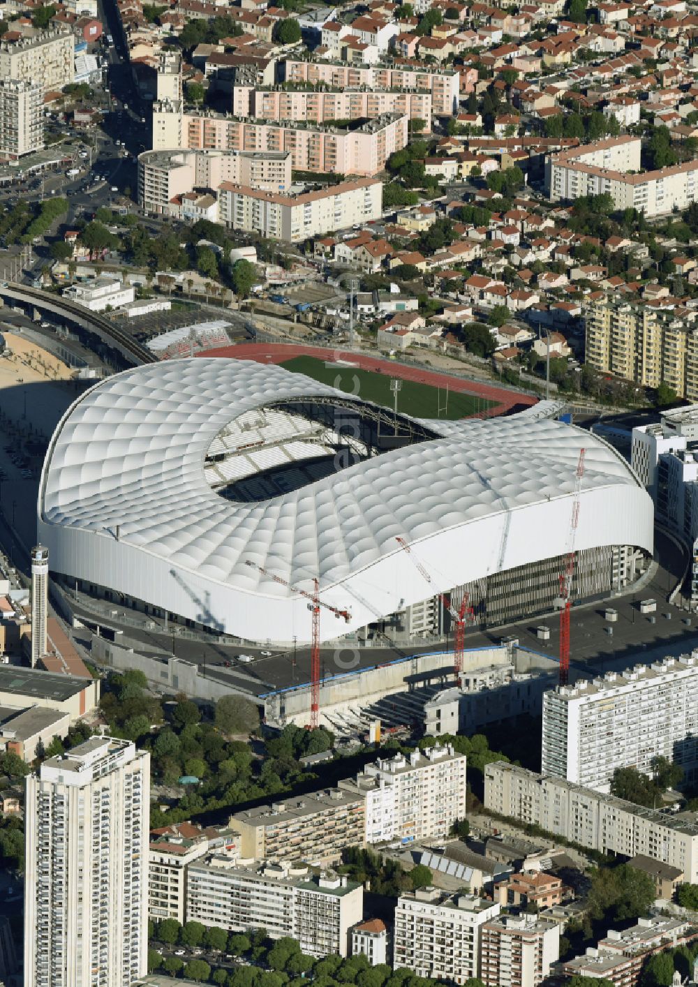 Marseille from above - Sports facility grounds of the Arena stadium Stade Orange Velodrome on street Boulevard Michelet in Marseille in Provence-Alpes-Cote d'Azur, France