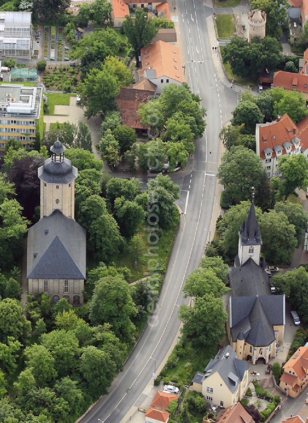 Aerial image Jena - Left and right of the road of June 17, in the center of Jena in Thuringia are the peace church and the Catholic Church of St. John Baptist Church. The peace church, which was formerly known as God's Acre Church or New St. John's Church, stands on the site of St. John's Cemetery. At the top of the screen is the Powder Tower to see a part of the former city wall of Jena
