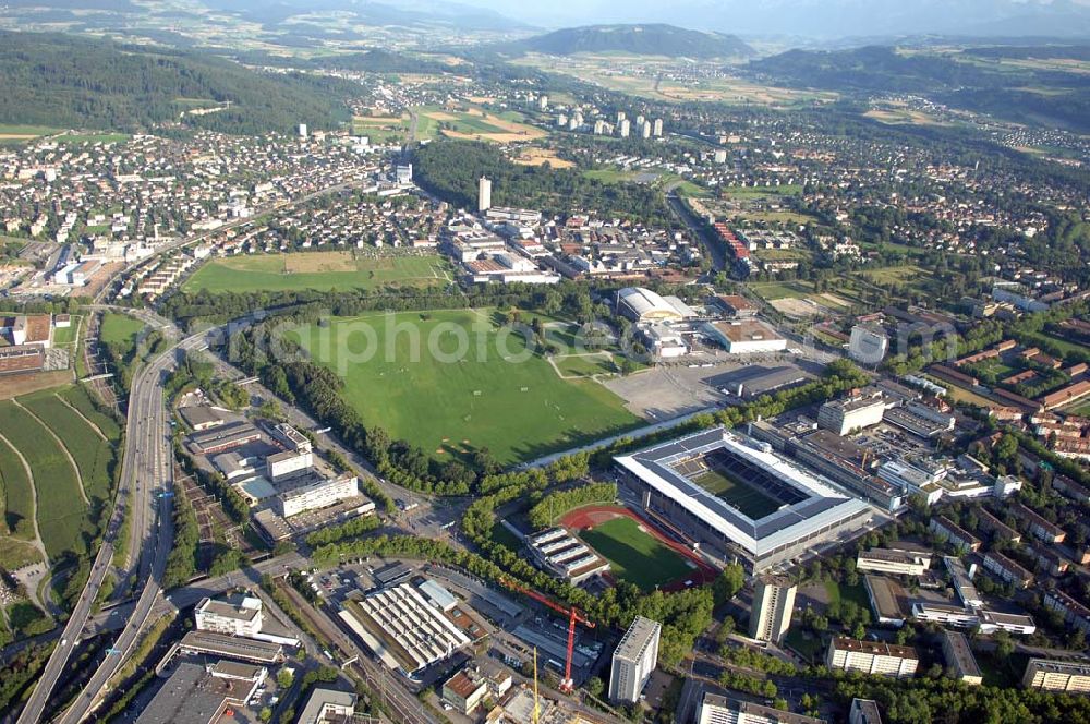 Aerial image Bern - Das Stadion Stade de Suisse Wankdorf Bern steht im Wankdorfquartier der Stadt in der Schweiz. Die Arena ist Heimstatt des Berner Fussballvereins BSC Young Boys (YB) und wurde durch die Baufirma Marazzi Generalunternehmung ( heute Losinger Construction AG) und die Baltensperger AG errichtet.
