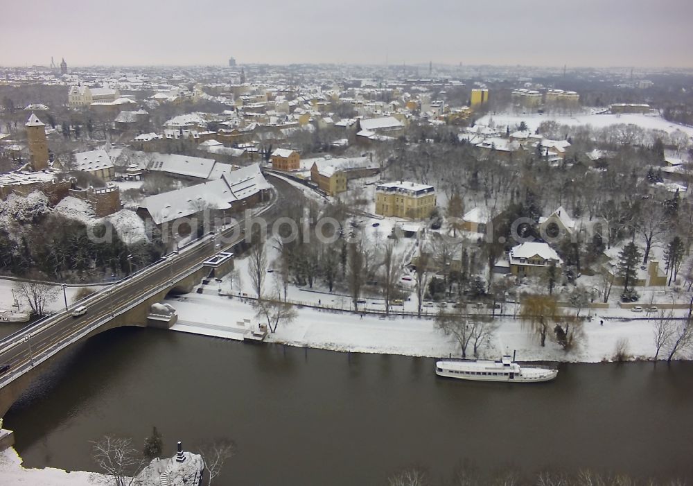 Halle (Saale) from above - Winter with snow covered area on the course of the river Saale at the Krollwitz bridge in Halle (Saale) in Saxony-Anhalt. Also pictured castle Giebichstein and the health center Medikum Halle