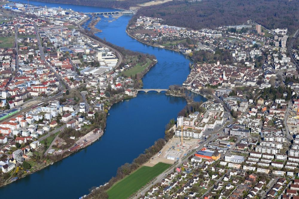 Rheinfelden (Baden) from the bird's eye view: City view on the river bank of the Rhine river showing Germany on the left and Switzerland (right) in Rheinfelden (Baden) in the state Baden-Wurttemberg, Germany. The old historical Bridge is connecting the two towns