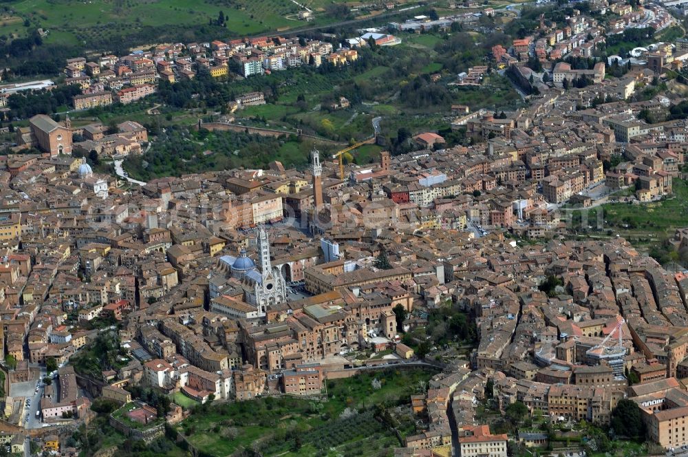 Aerial image Siena - Cityscape with the historic old town with the cathedral of Siena in Italy. The city is famous for the Palio di Siena, a horse race that takes place on the central Piazza del Campo. The historic center of Siena is one of the most beautiful cities of Tuscany and is a UNESCO World Heritage Site