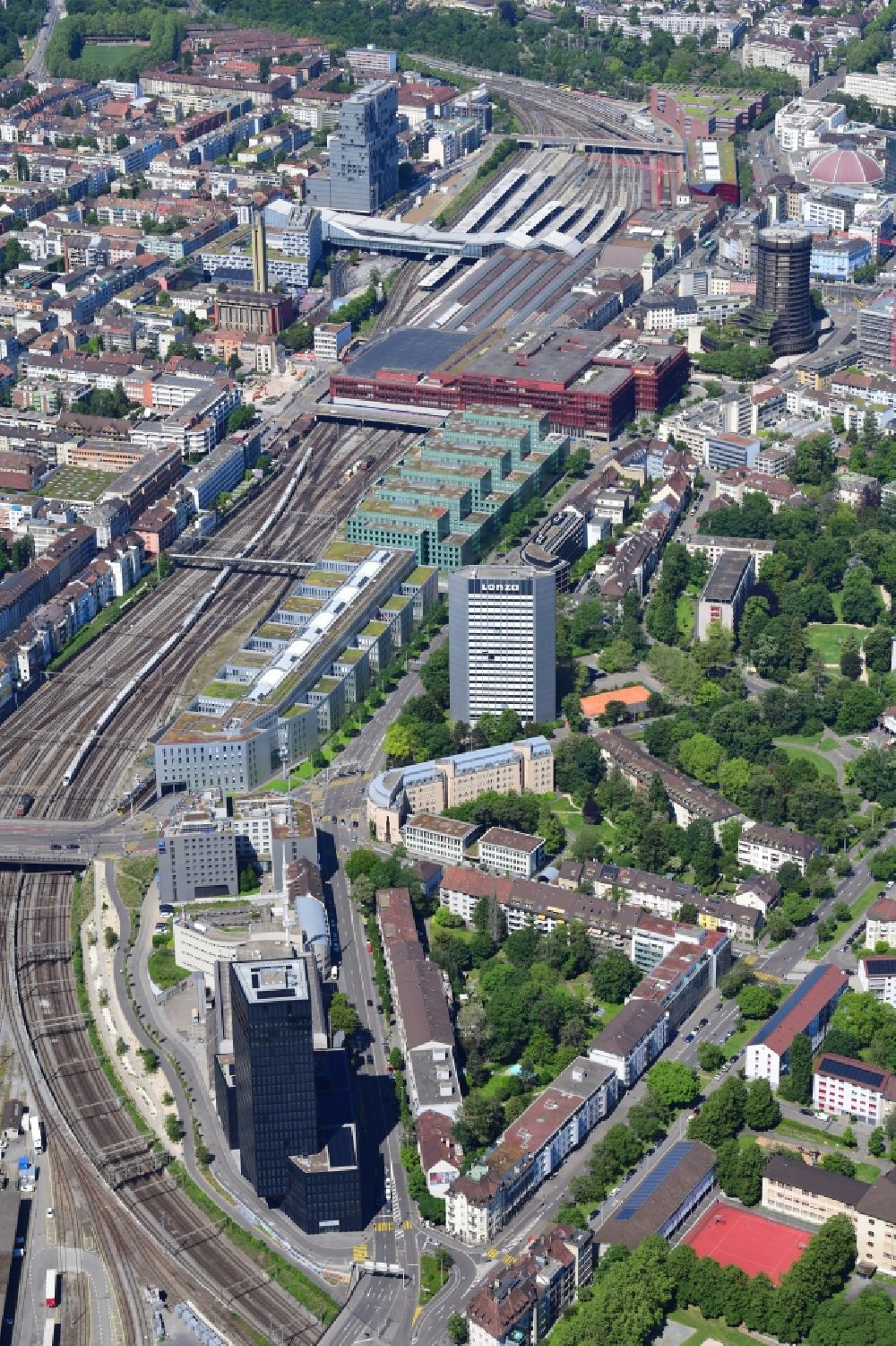 Aerial photograph Basel - City view on down town at the rails next to the station SBB, at the Grosspeteranlage Grosspeter Tower in Basel, Switzerland