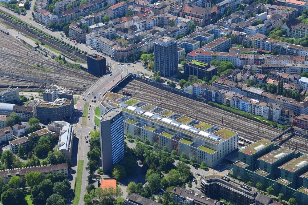 Aerial photograph Basel - City view on down town at the rails next to the station SBB, the high-rise buildings of Lonza and Coop in Basel, Switzerland
