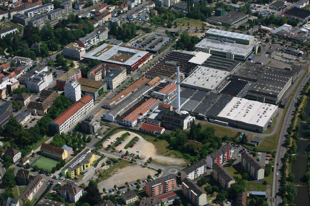 Lörrach from above - City view of the center in Loerrach in the state Baden-Wurttemberg. Buildings of business development and location of company enterprises on the grounds of textile manufacturer KBC Fashion GmbH