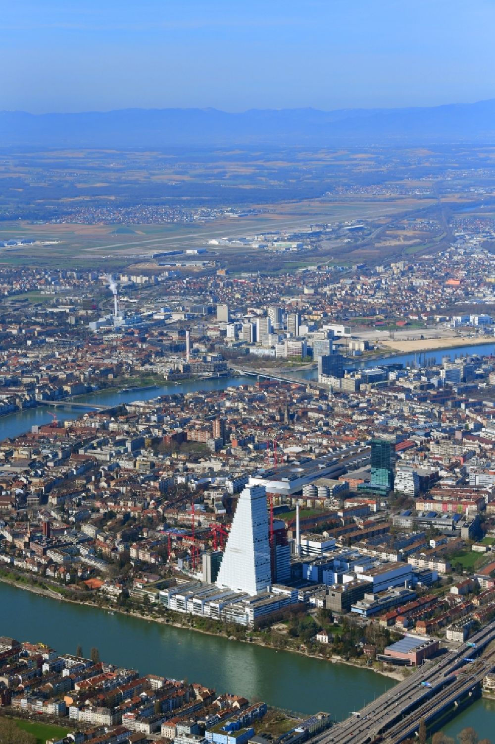 Aerial image Basel - City view with the impressive Roche Tower and the river Rhine in Basle, Switzerland