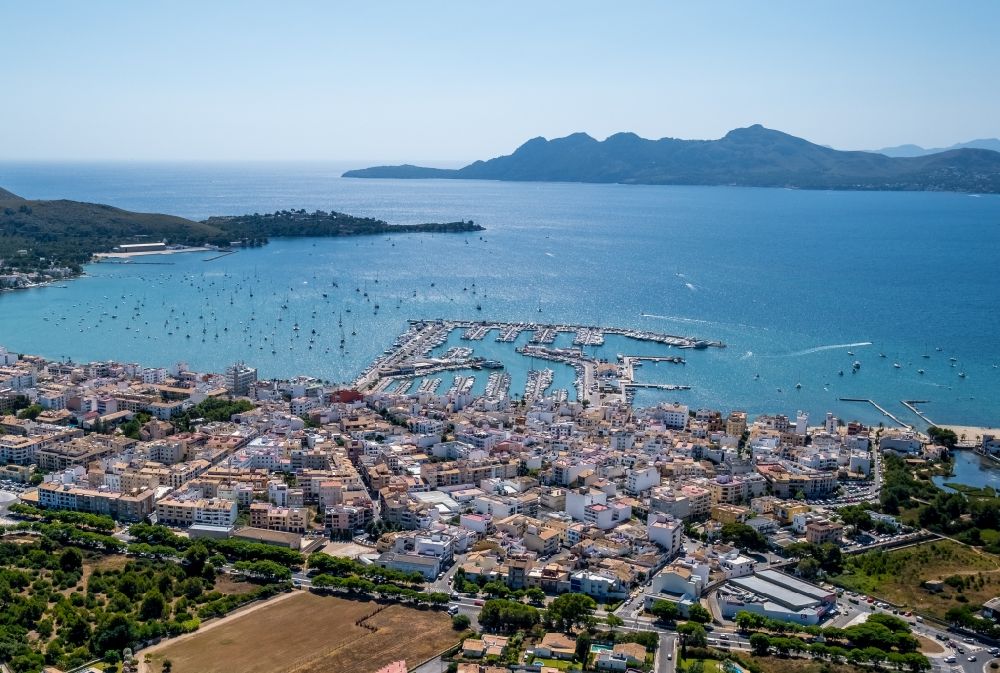 Aerial image Port de Pollenca - City view on sea coastline at the bay in Port de Pollenca in Balearic island of Mallorca, Spain
