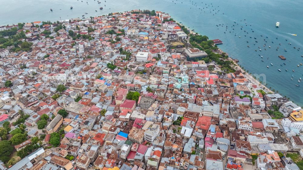 Aerial image Zanzibar - City view on sea coastline Stone Town in ZansZbar in Unguja Mjini Magharibi, Tanzania